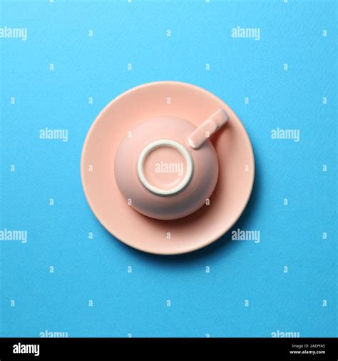 Pink coffee cup on blue background Stock Photo - Alamy