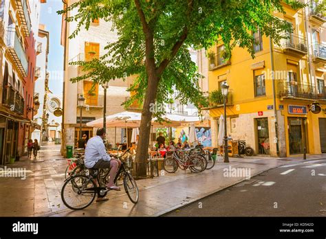 Valencia Spain old town, view of people sitting outside a bar in a ...