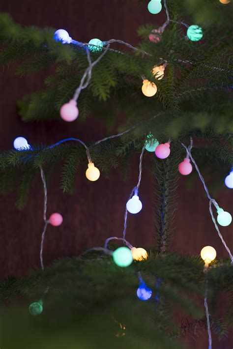 Photo of Colorful glowing round Christmas tree lights | Free christmas ...