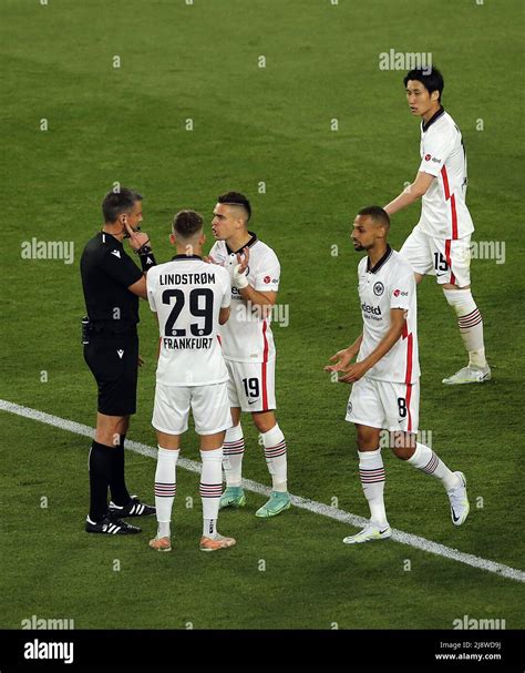 Eintracht Frankfurt players appeal to referee Slavko Vincic for a hand ...