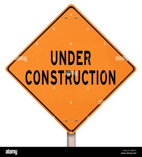 Orange Warning Sign - Under Construction Stock Photo - Alamy