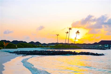 Premium Photo | Picturesque sunrise in the maldive island, view on water villas at sunrise in ...