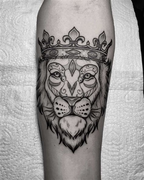 Lion with a crown tattoo - Tattoogrid.net