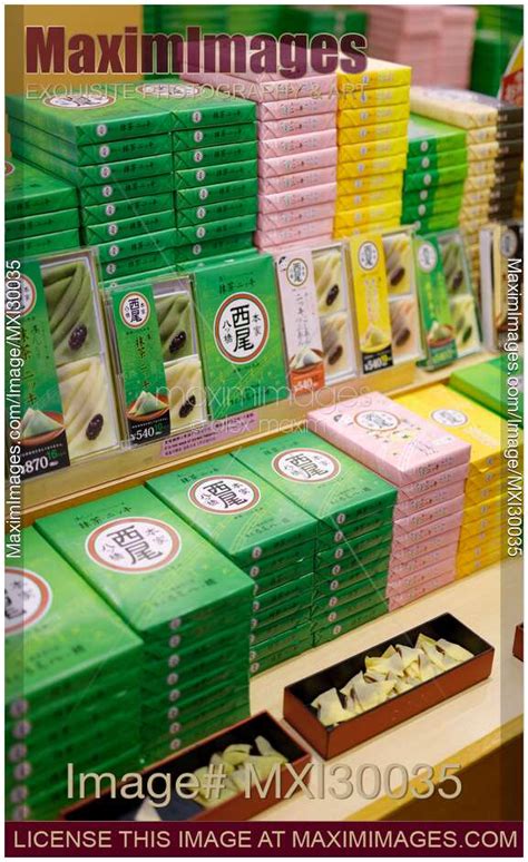 Photo of Traditional Kyoto treats Yatsuhashi triangles with red bean paste on store display ...