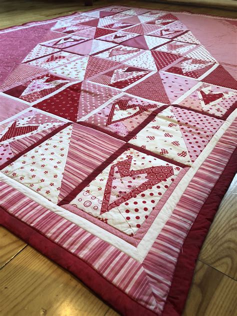 A twin size red quilt with patchwork harts inspired by Buggy Barn crazy heart design. Perfect ...