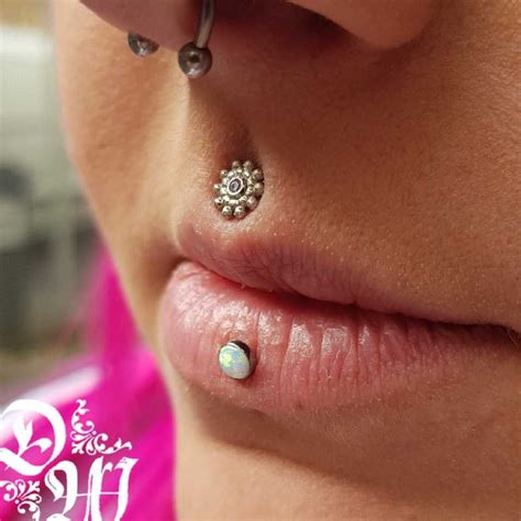 Philtrum piercing using a white gold 10pt Sabrina with a clear CZ ...