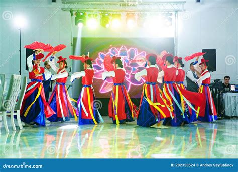 Dancers in National Costumes Dance a Traditional Korean Dance with a ...