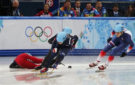 China’s Shi Jingnan crashes during the men’s 1,500 metres short track speed skating heats event ...