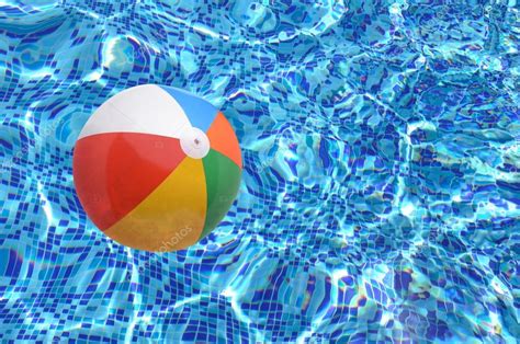 Beach ball in swimming pool — Stock Photo © chones #116429966