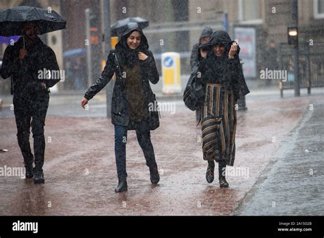 People walking through heavy rain in Birmingham city centre. The Met ...