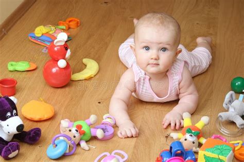 Baby playing with a toys stock image. Image of care, laugh - 7241489