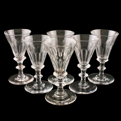 The sherry glasses have a trumpet shaped bowl with facet cut sides, a ...