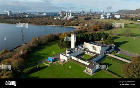 Editorial SWANSEA, UK - November 25, 2023: Aerial view of Margam crematorium, Tata steel works ...