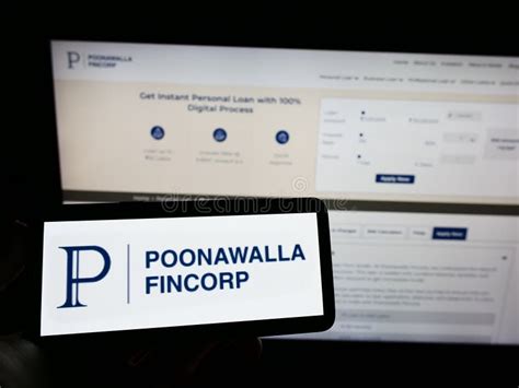 Person Holding Mobile Phone with Logo of Financial Company Poonawalla Fincorp Limited on Screen ...