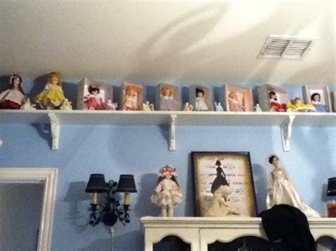 A small shelf to put dolls snow globes books or nick nacks on so it is reserved and protected ...