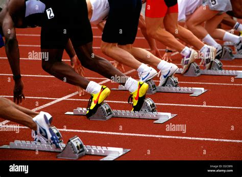 Runners At Start Of Race, Feet Leaving Starting Blocks Stock Photo: 53132890 - Alamy