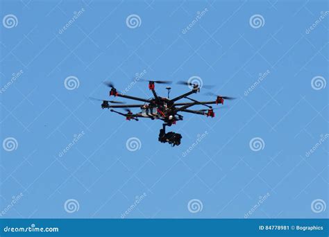 Hexacopter Drone with Camera in Action on Blue Sky Stock Image - Image ...