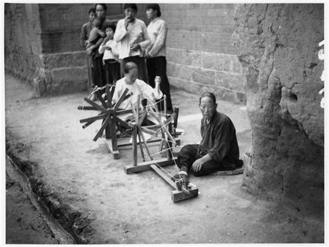 Women spinning cotton by hand, in a street, 1938 | Historical Photographs of China