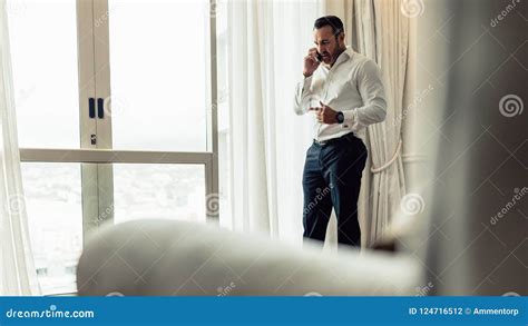 Businessman Making a Phone Call from Hotel Room Stock Photo - Image of suite, corporate: 124716512