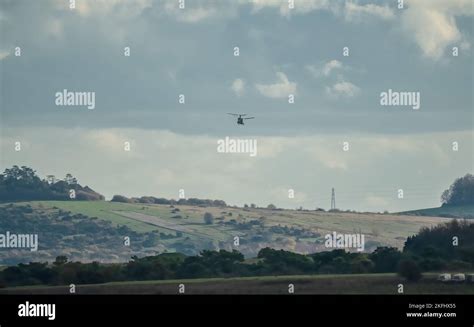 RAF Chinook tandem-rotor CH-47 helicopter flying fast and low in a ...