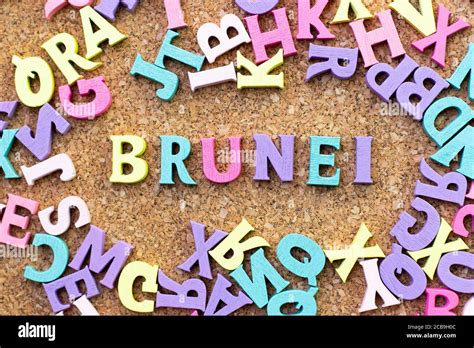 Color alphabet in word Brunei with another letter as frame on cork ...