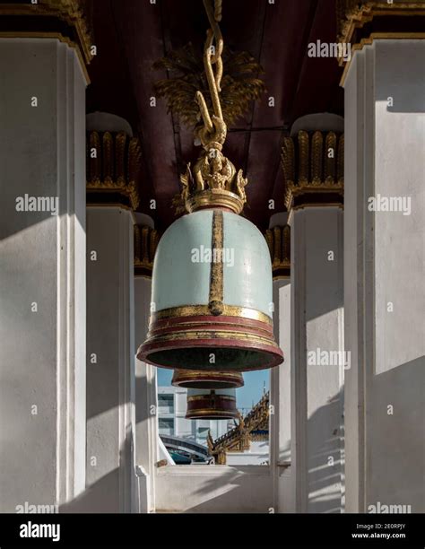 Ancient bells hanging on pillars outside in the thai temple. Thai ...