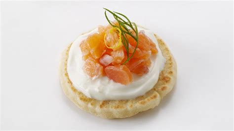 Smoked salmon blini canapés recipe - BBC Food