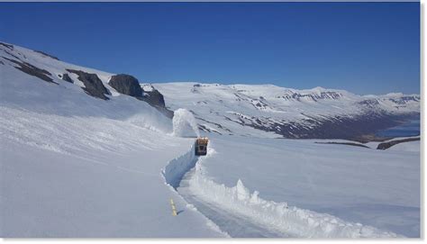 Snow walls of up to 16 feet high along road in East Iceland - snowfall considerably more than ...