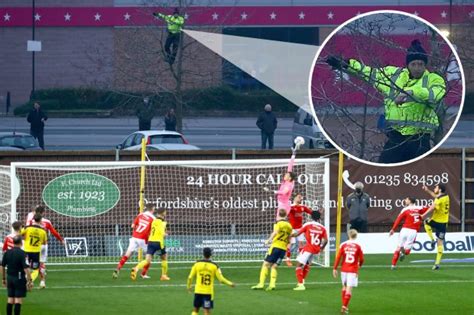 Oxford United fans watch clash with Swindon from tree and on top of van ...