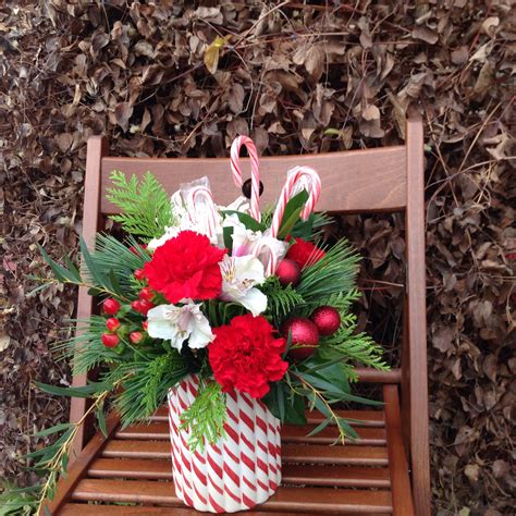 Candy cane floral arrangement #christmas #flowers | Christmas floral, Christmas floral ...