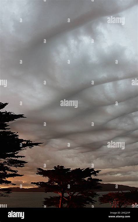 Storm cloud formations at sunset Stock Photo - Alamy