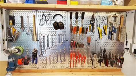 Neat and tidy metal pegboard tool set up by Randy! Garage Tool Storage, Garage Tools, Peg Board ...