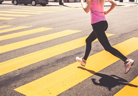 Athletic Woman Running Over the Pedestrian Crossing - High Quality Free ...