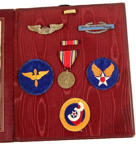 BOOK OF WWII ARMY AIR CORPS MEDALS AND PATCHES : Lot 9433