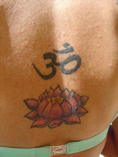 Lotus flower with aum mantra on back - Tattooimages.biz