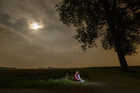 Young Girl Sitting Alone In The Dark Stock Photo - Image: 46209439