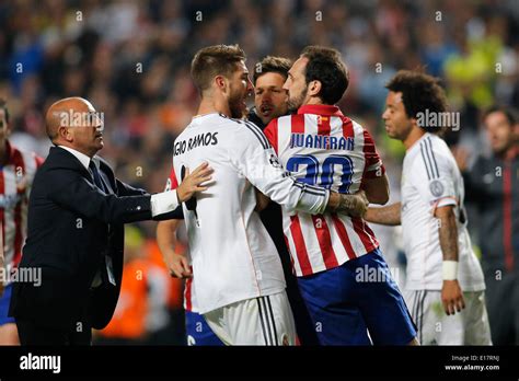 Sergio Ramos (Real Madrid CF #4) holding back Juanfran (Atletico Madrid ...