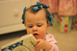 Baby girl reading with hair in curlers | 1st time in sponge … | Flickr