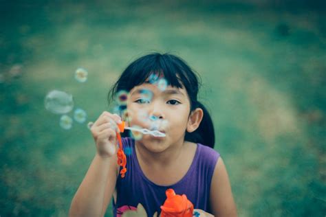 Girl Blowing Bubbles Royalty Free Photo