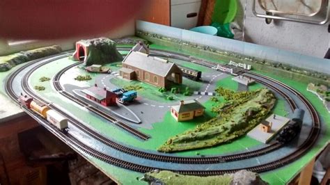 Model railway layout.OO gauge.Includes 2 working locos,rolling stock,controller and buildings ...