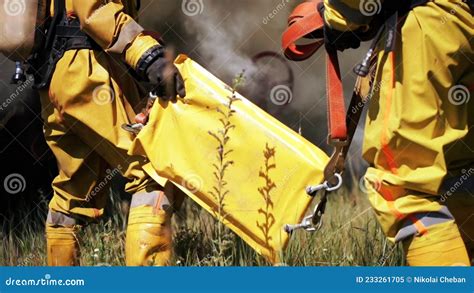 Firefighters Use Their Equipment. Clip. Rescuers Use Water To Extinguish or Check the Operation ...