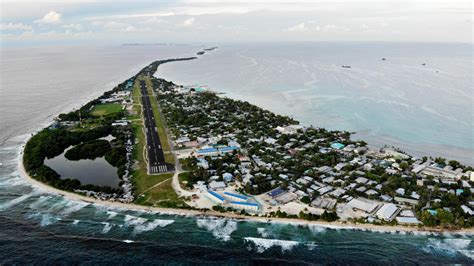 'Tuvalu is sinking': Island nation threatened by sea level rise looks for salvation