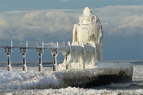 winter hits st. joseph lighthouse, michigan lake photo | One Big Photo