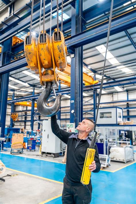 Operator Using an Industrial Crane in a Logistics Factory Stock Image - Image of teamwork ...