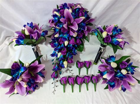 Real touch purple tiger lilies and roses with off white tulips and our famous blue galaxy ...