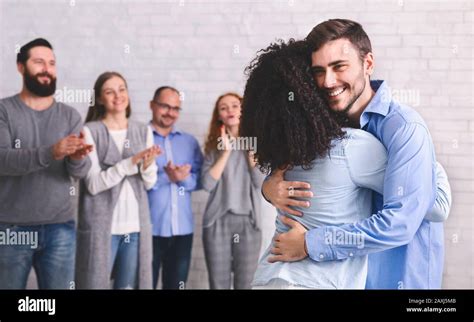 Happy Man With Autism Hugging Friend After Successful Haphephobia Treatment Stock Photo - Alamy