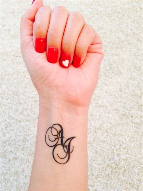 Initials tattoo with script AJ | Hand tattoos for guys, Small hand tattoos, Hand tattoos