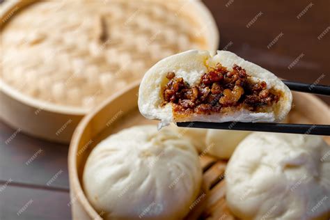 Premium Photo | Chinese breakfast. Steamed buns and porridge are on the ...