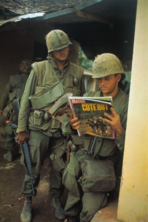 USMC looking at the photos in French magazine Match, in Hue City, 1968 ...