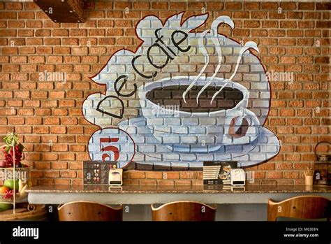 Wall art advertising in a coffee shop interior Stock Photo: 175868693 - Alamy